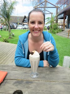 Sonia enjoying a cookies and cream milkshake after a morning surfing