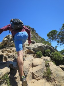 Scrambling up the rocks to the top of Lions Head