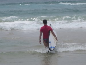 Sonia walking out to the waves