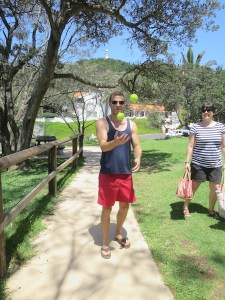 Rich attempting to juggle two balls with one hand