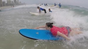 Sonia paddling the wave