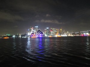 The Parade of Lights boats passing in front of the Opera House