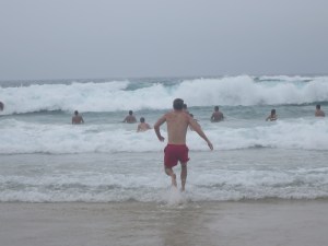Rich running into the sea at Bondi beach