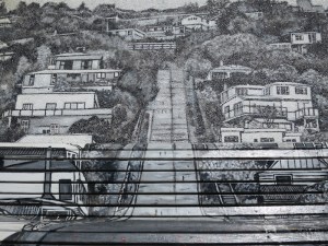 A painting of the street covers the bench and wall at the top of the street.