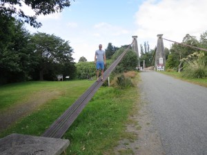 Rich climbing the suspension cables of the bridge