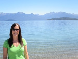 Sonia at Lake Manapouri with Cathedral mountains in the background