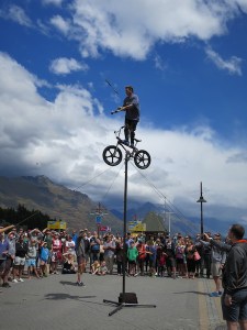A street entertainer has everyone enraptured in Queenstown Bay