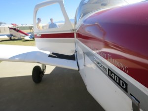 Rich getting shown around the plane by his instructor