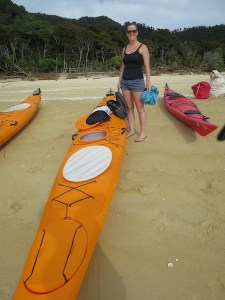 Sonia packing her belongings into the kayak