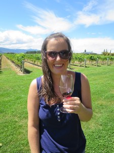 Sonia enjoying the wind and a glass of pinot noir at Spy Valley winery