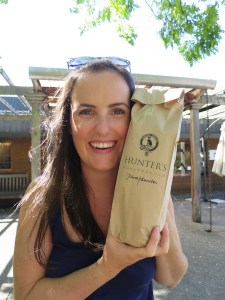 Sonia thrilled with a bottle of the pick of the day to drink later - Hunter's 2014 Sauvignon Blanc