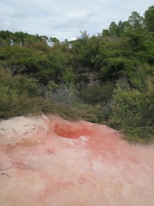 Iron oxide minerals give this crater its red hue