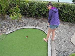 Sonia playing crazy golf on Deco Drive