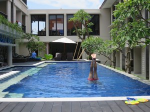 Rich practising handstands in the pool