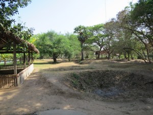 The exhumed graves at Choeung Ek are still sunken pits