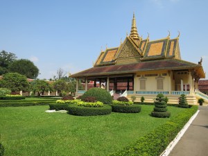Manicured gardens and beautiful buildings inside The Royal Palace