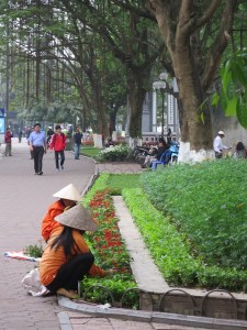 Vietnamese gardeners looking after the flowerbeds