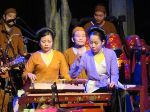 The musicians accompanying the water puppet show