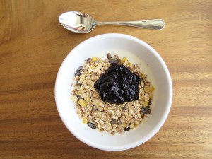 Yummy breakfast of yoghurt, muesli and berry compote