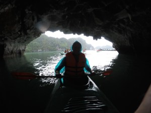 Rich at the back of the kayak inside the cave
