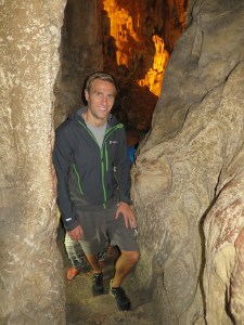 Rich walking through the passageway between two of the caves