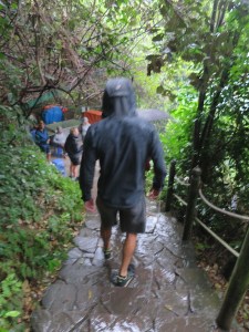 Rich walking back down to the boat in the downpour
