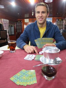 Enjoying a game of cards and a hot drink on the boat