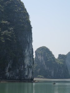 The rowing boats looked tiny against the towering limestone islands
