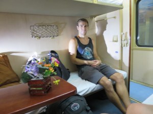 Rich sitting on his bed in our cabin