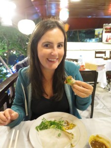 Sonia enjoying shrimp spring rolls, a Hoi An specialty
