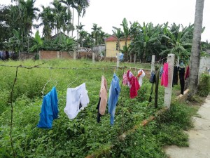 Washing hung out on a fence - a familiar sight in Hoi An