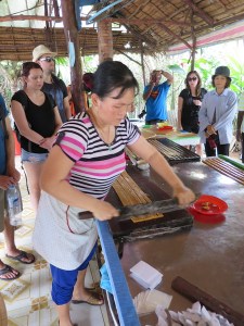 Cutting up the coconut sweets