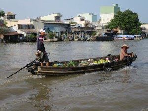 Fruit seller getting ready to hook onto our boat