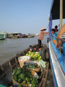 Fruit sellers hooked onto our boat