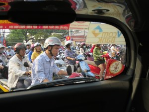 Lots of scooter riders in the Ho Chi Minh City streets