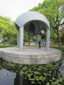 Sonia ringing a memorial bell in the peace park